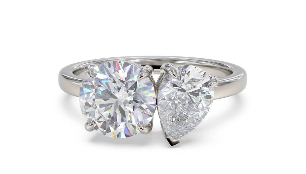 Round & Pear Two Stone Diamond Ring set in Platinum