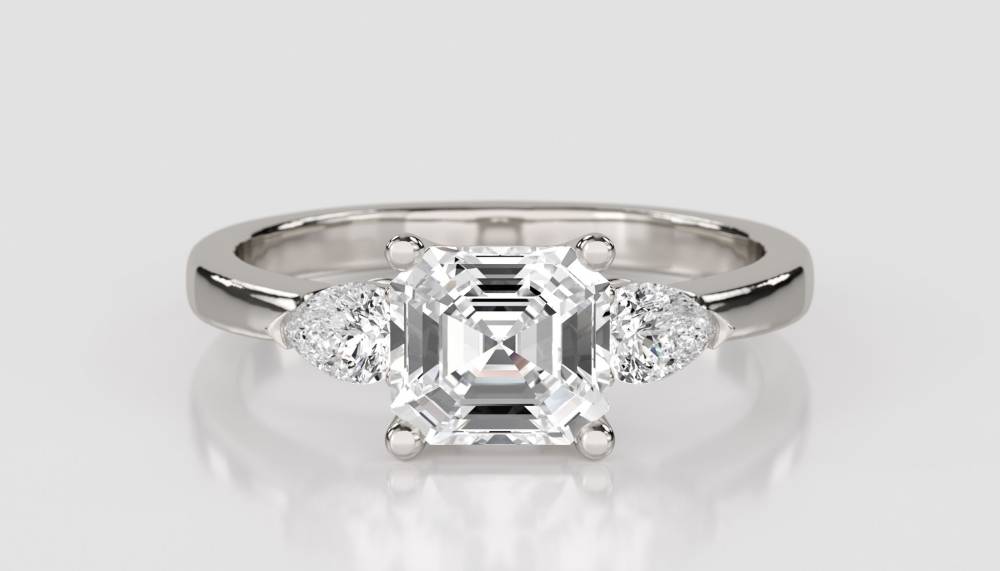 Elegant Asscher & Pear Diamond Trilogy Ring set in Platinum